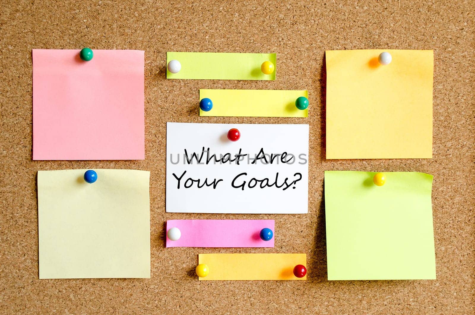 Colorful sticky notes on cork board background