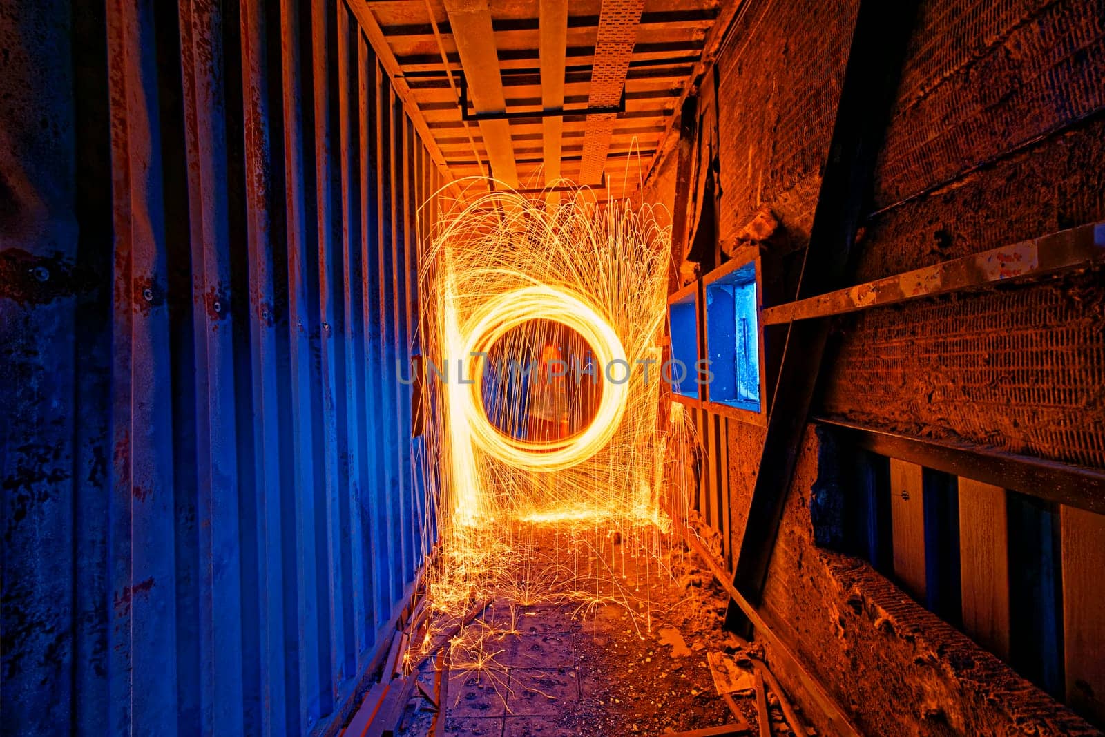 Burning Steel Wool spinning. Showers of glowing sparks from spinning steel wool in ruins