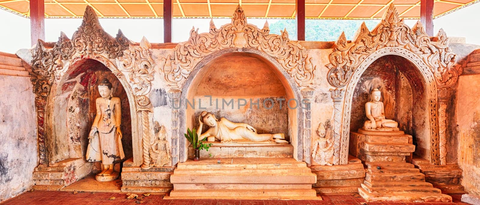 Three Buddha statues at Takhaung Mwetaw pagoda in Sankar. Myanmar.