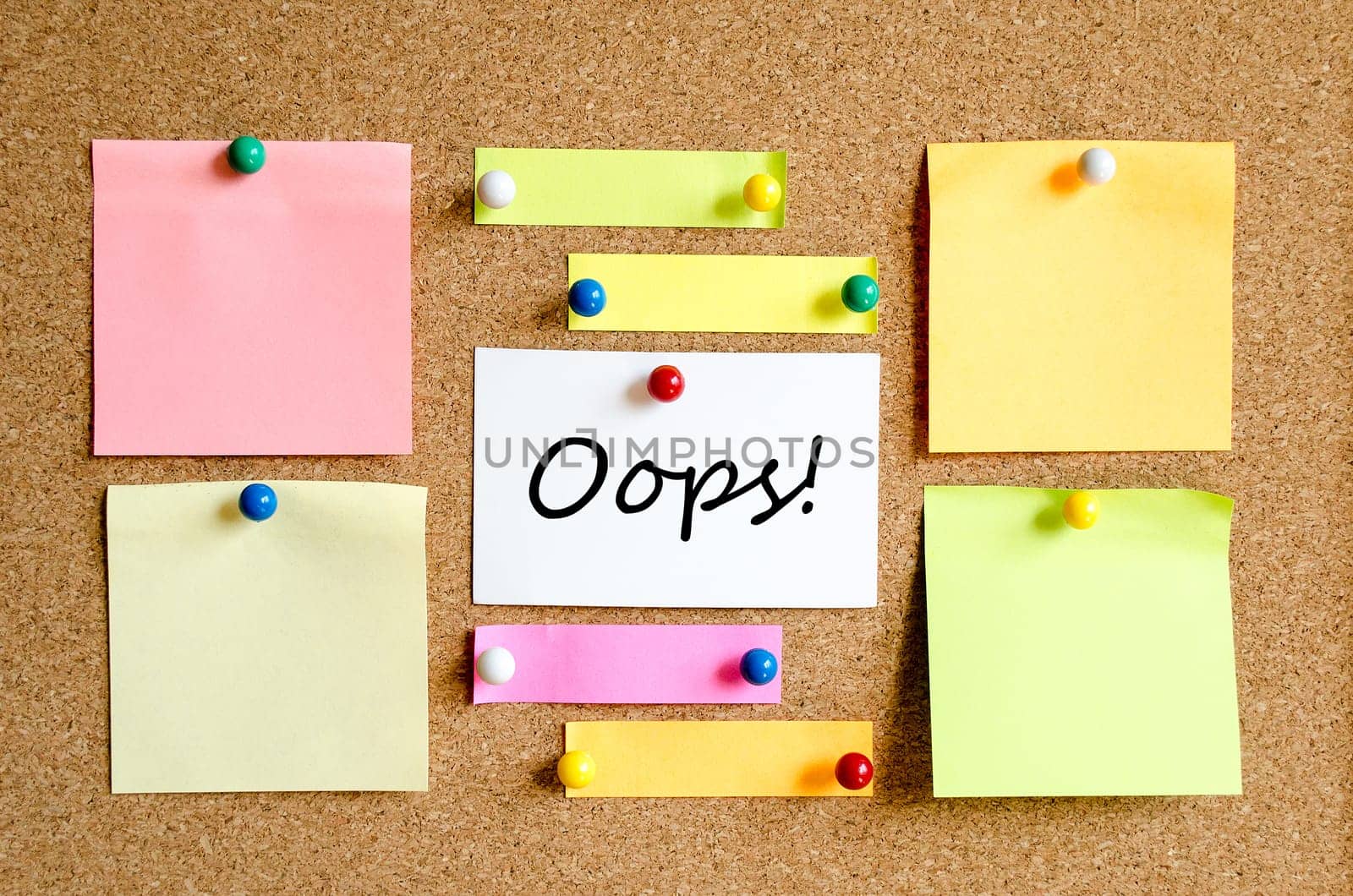 Colorful sticky notes on cork board background