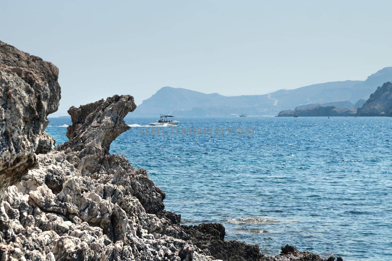 Kolymbia beach with the rocky coast in Greece.