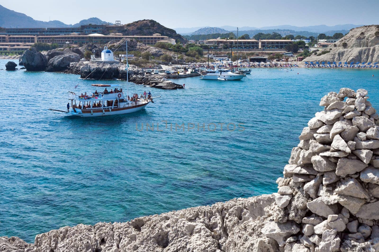 Kolymbia beach with the rocky coast in Greece.