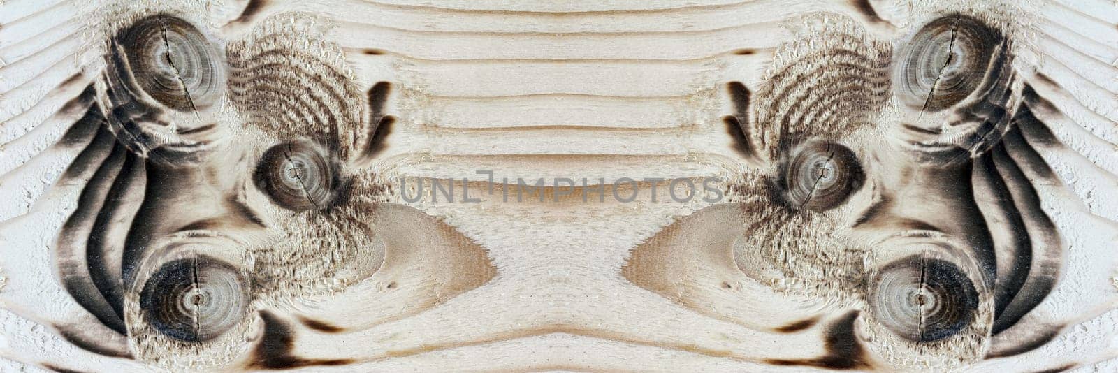 Wooden boards with branch holes. A pattern on a wooden board