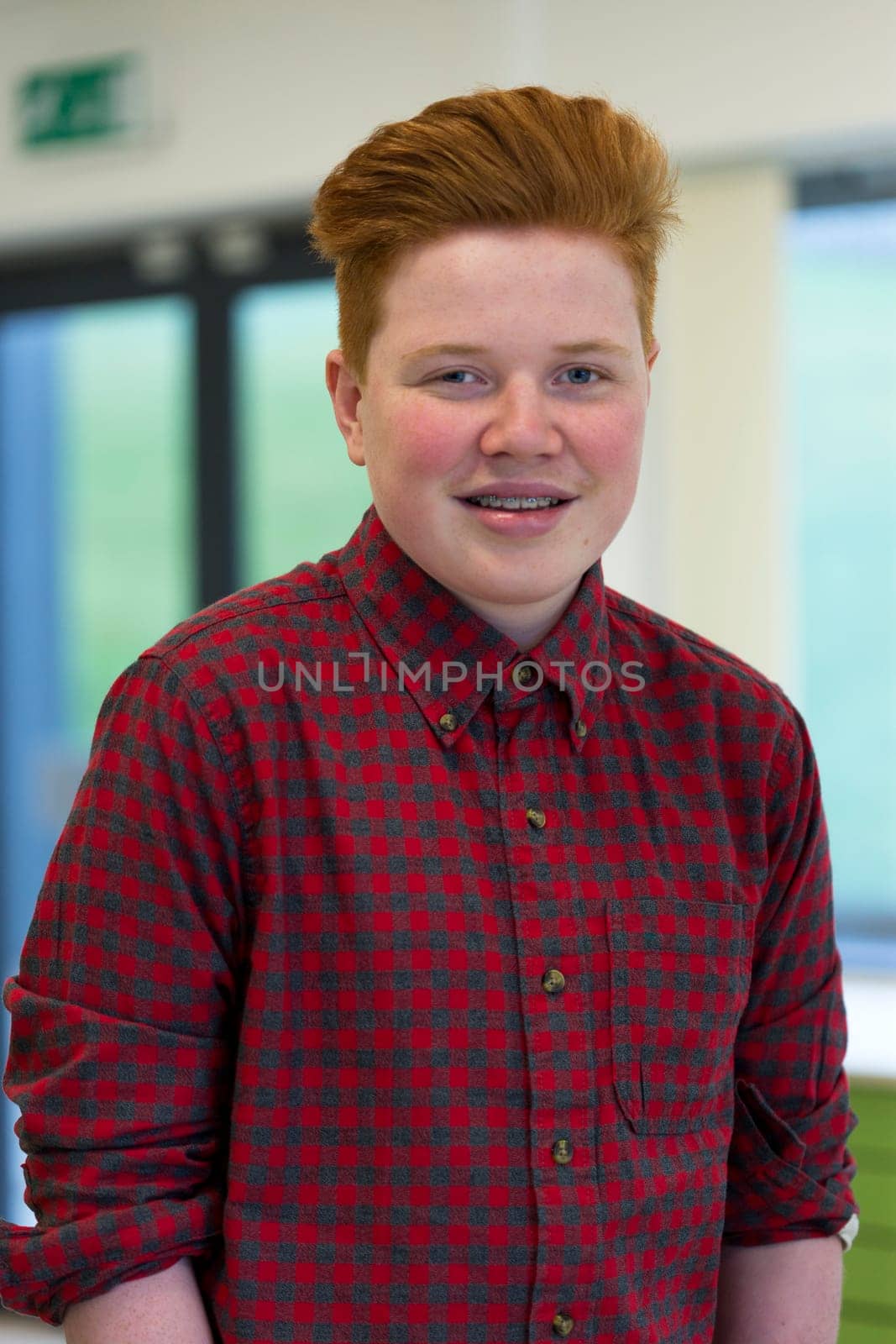 Portrait of a teenage boy at school.