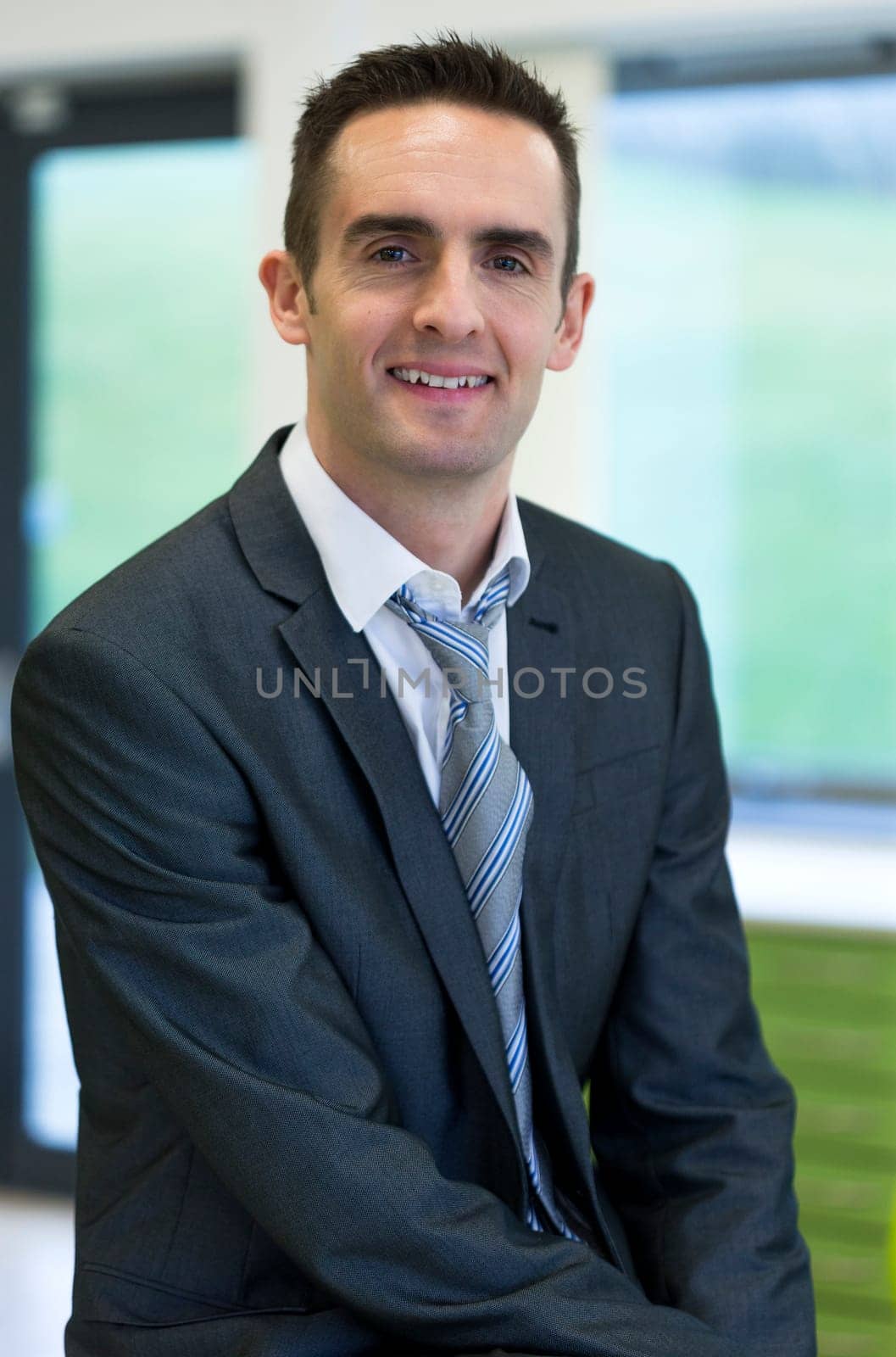 Portrait of a head teacher in a classroom.