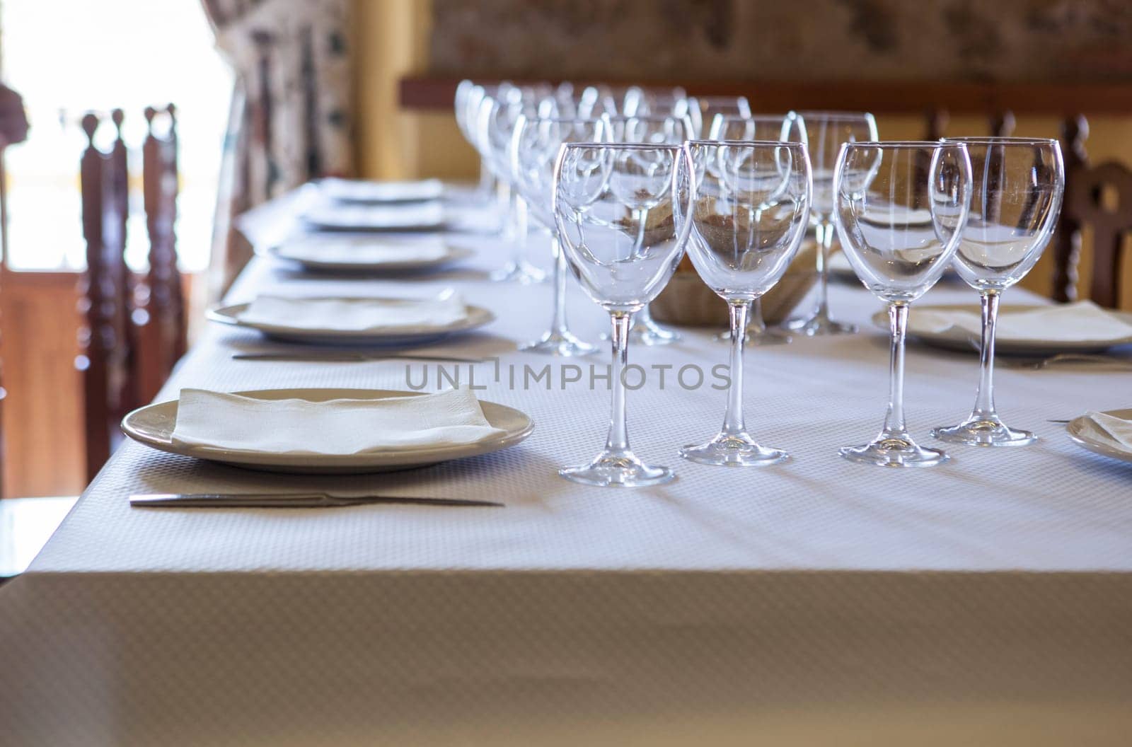 Tables ready and waiting for the guests to arrive at a rustic restaurant