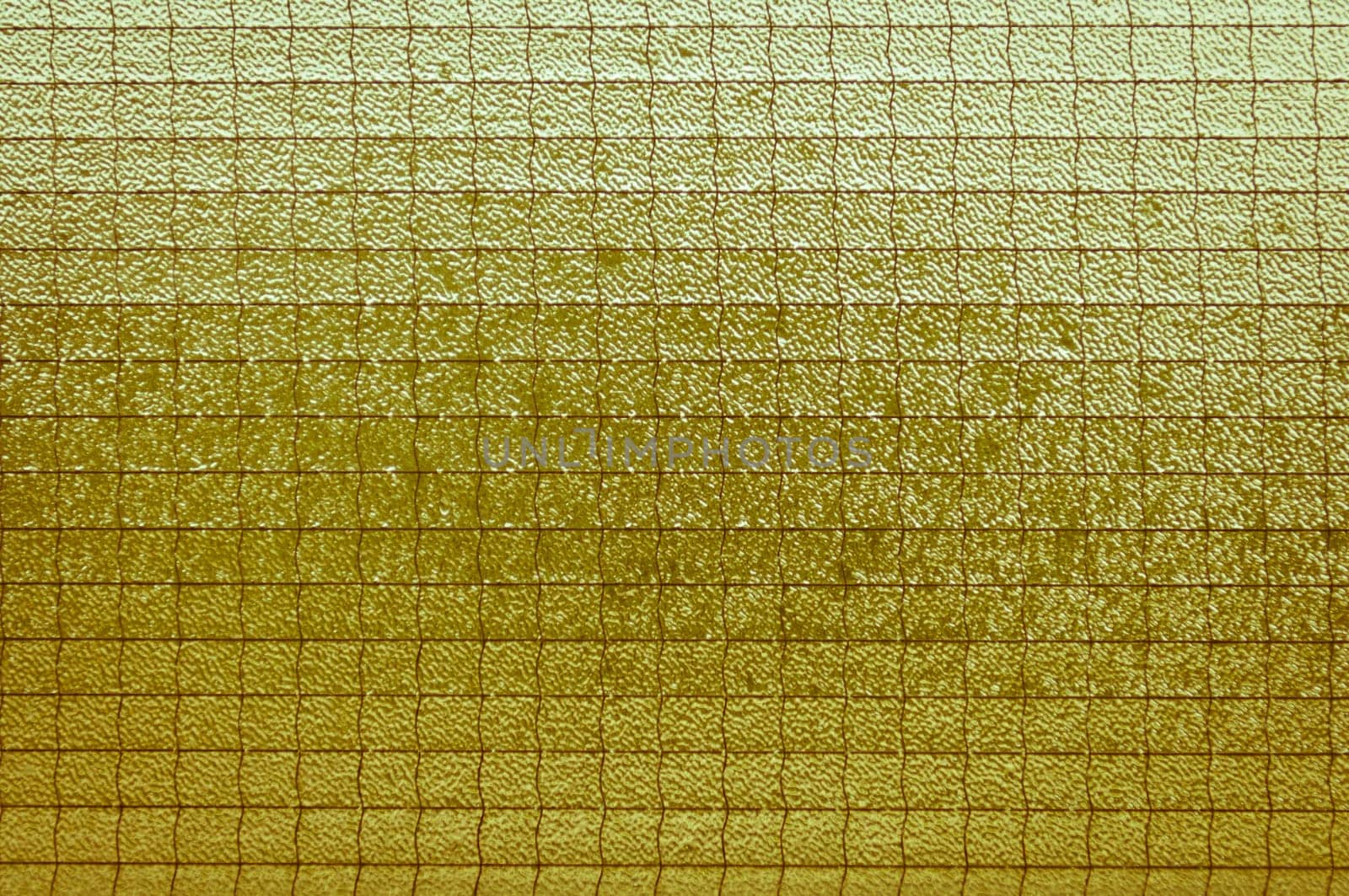Old light yellowish-brown glass vintage background, textured