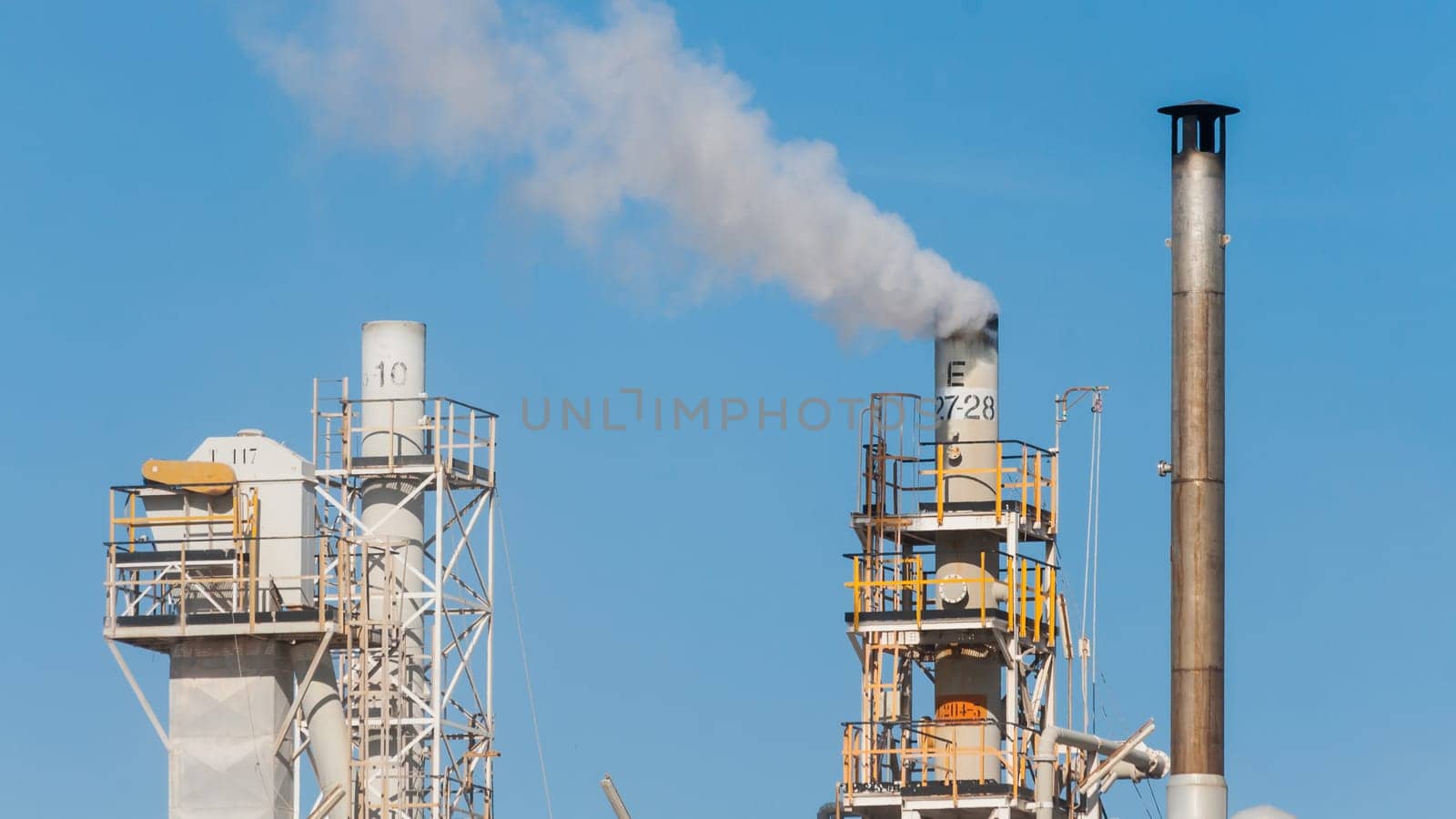 White smoke in the blue sky