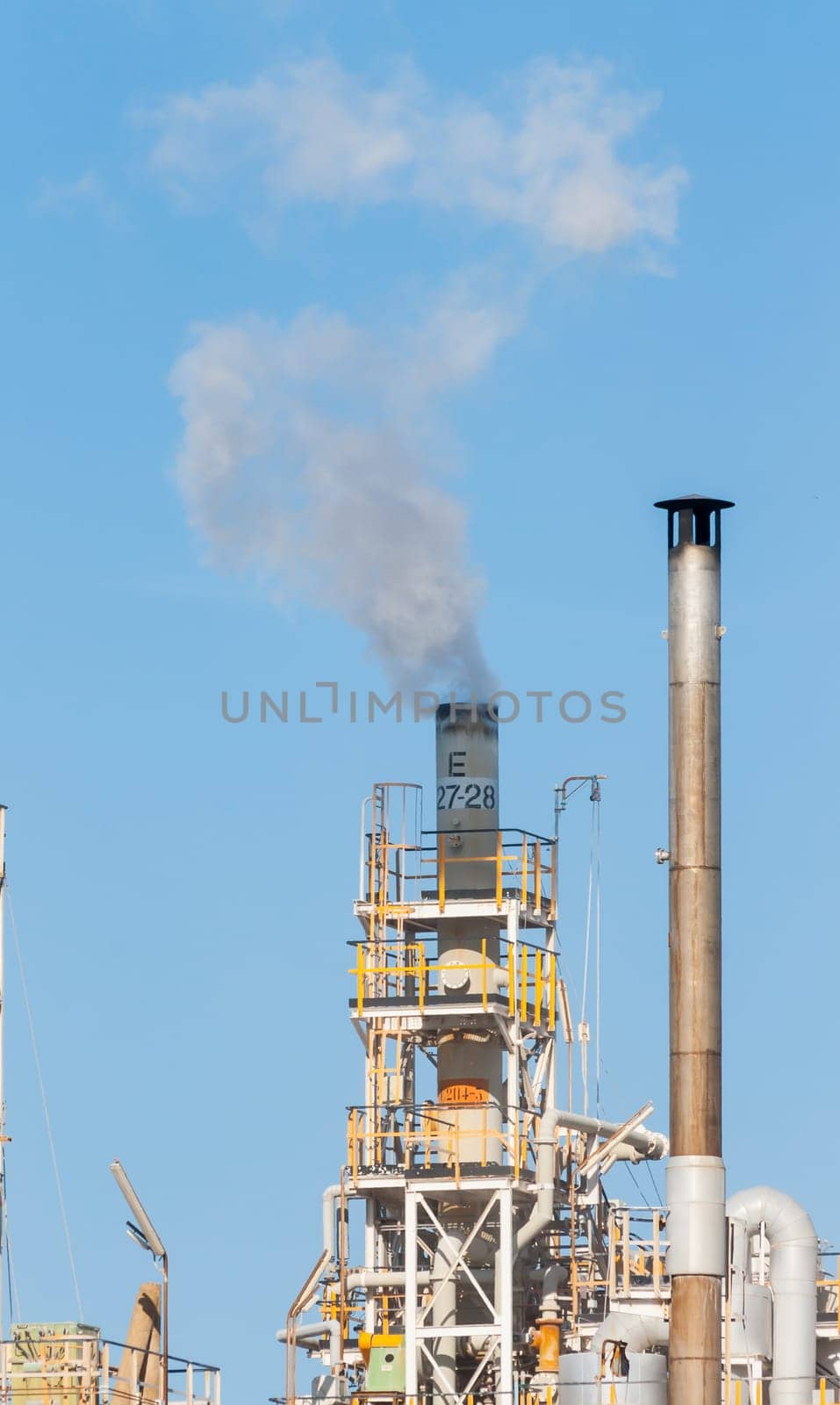 White smoke in the blue sky
