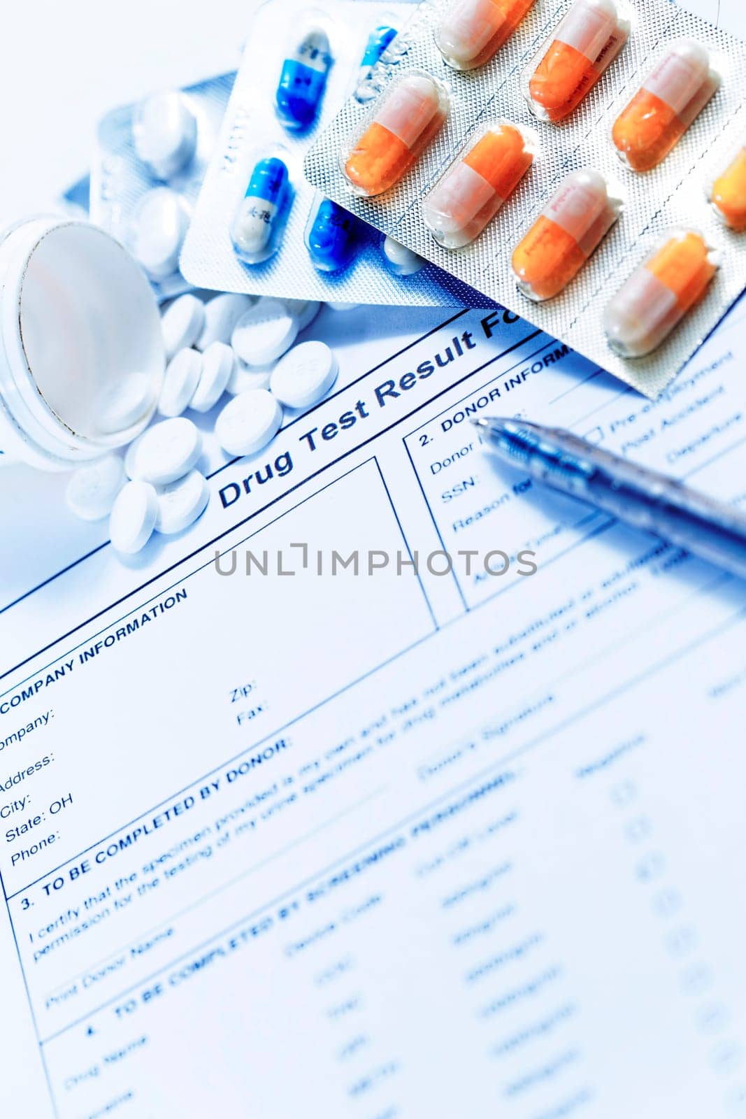 Syringe with glass vials and medications pills drug on white