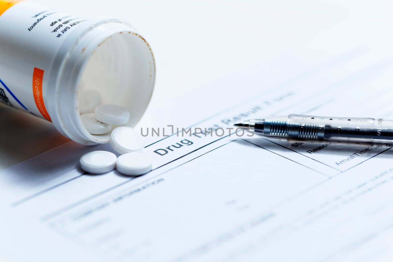 Syringe with glass vials and medications pills drug on white