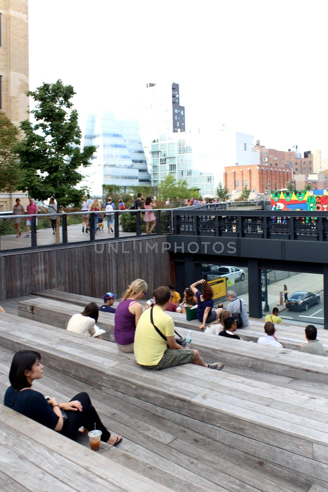 NEW YORK CITY - SEPTEMBER 03: People at High Line Park in NYC on September 03th, 2013. The High Line is a public park built on an historic freight rail line elevated above the streets on Manhattan West Side.