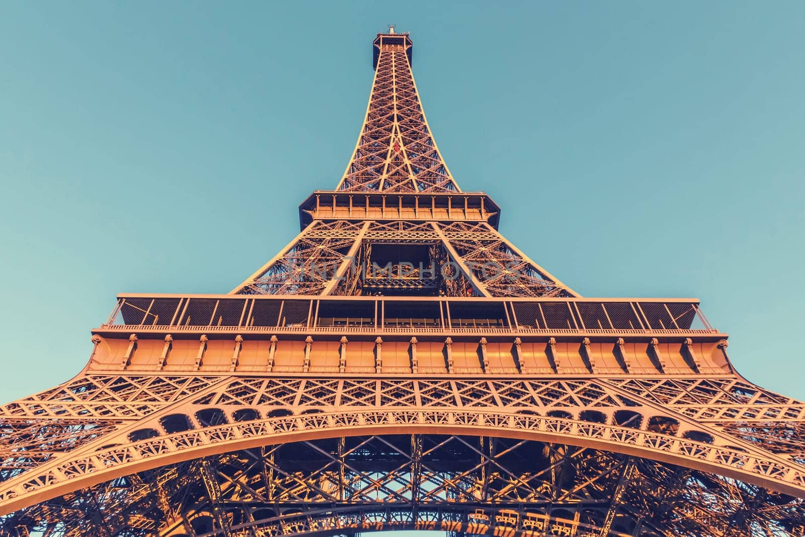 The Eiffel Tower, located on the Champ de Mars in Paris, France, selective focus, vintage effect