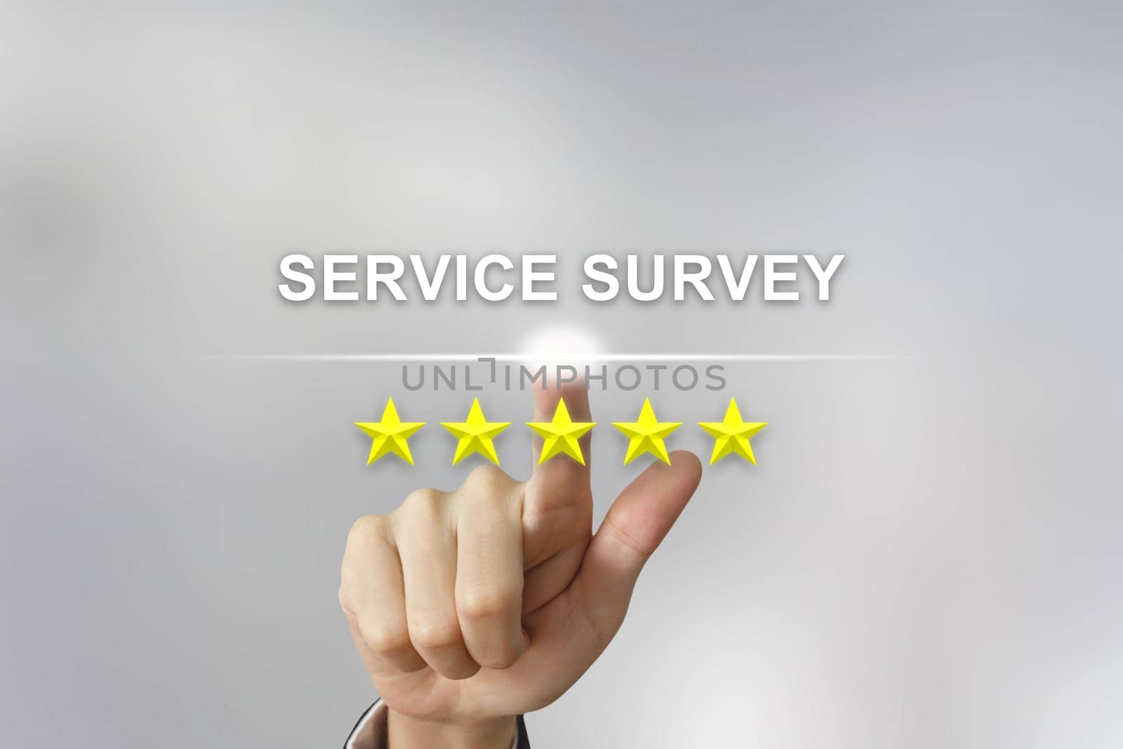 business hand clicking service survey with five stars on screen