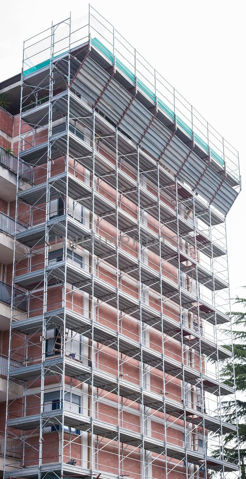 House for renovation with the scaffolding for bricklayers