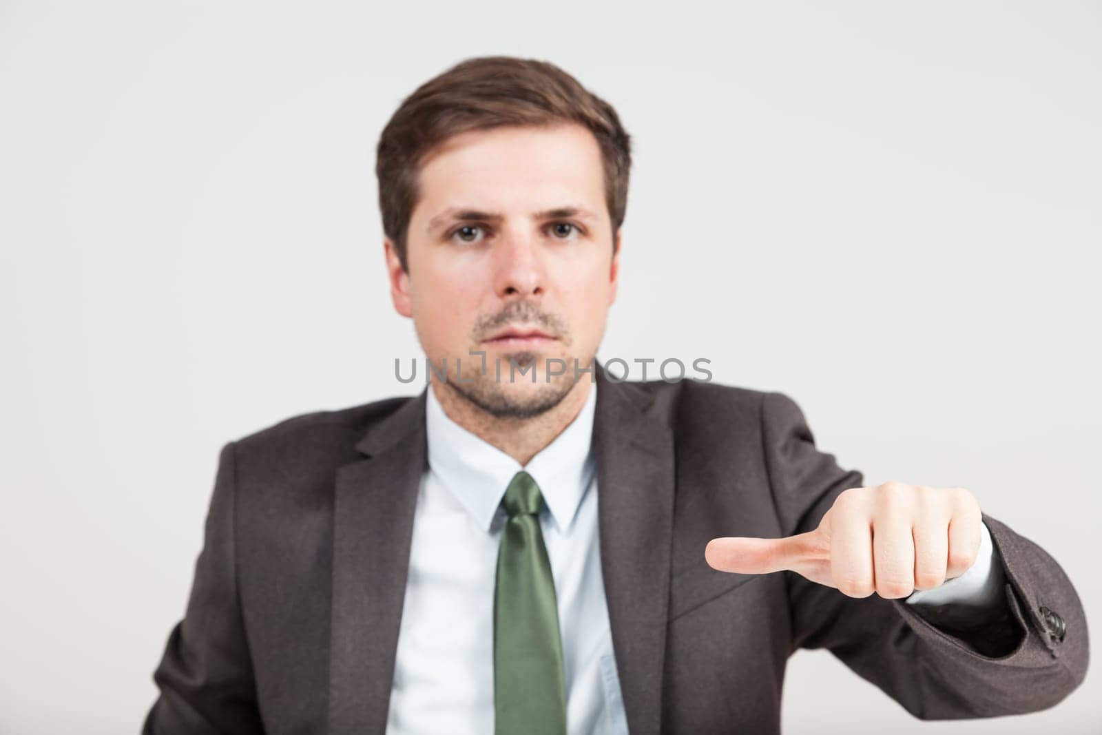 hands of businessman with thump in middle