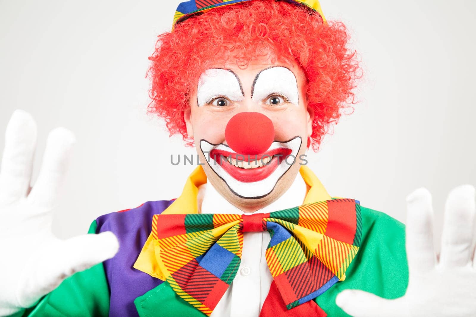 smiling clown with white gloves