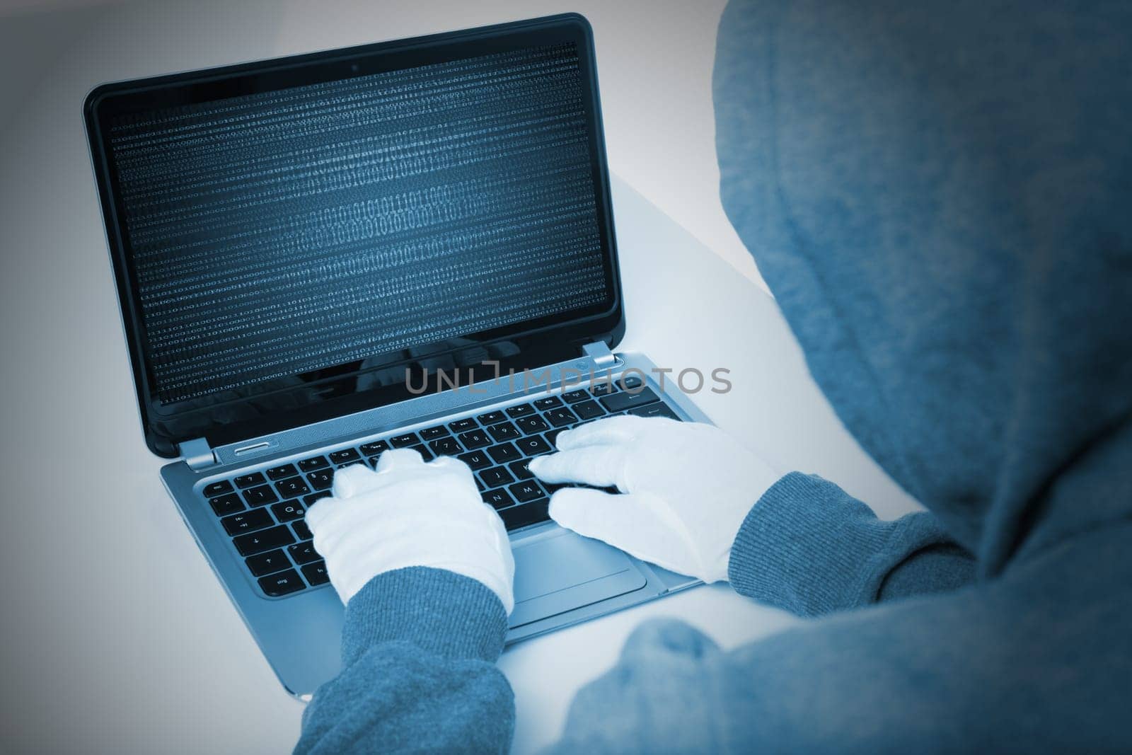 hacker on laptop in blue color