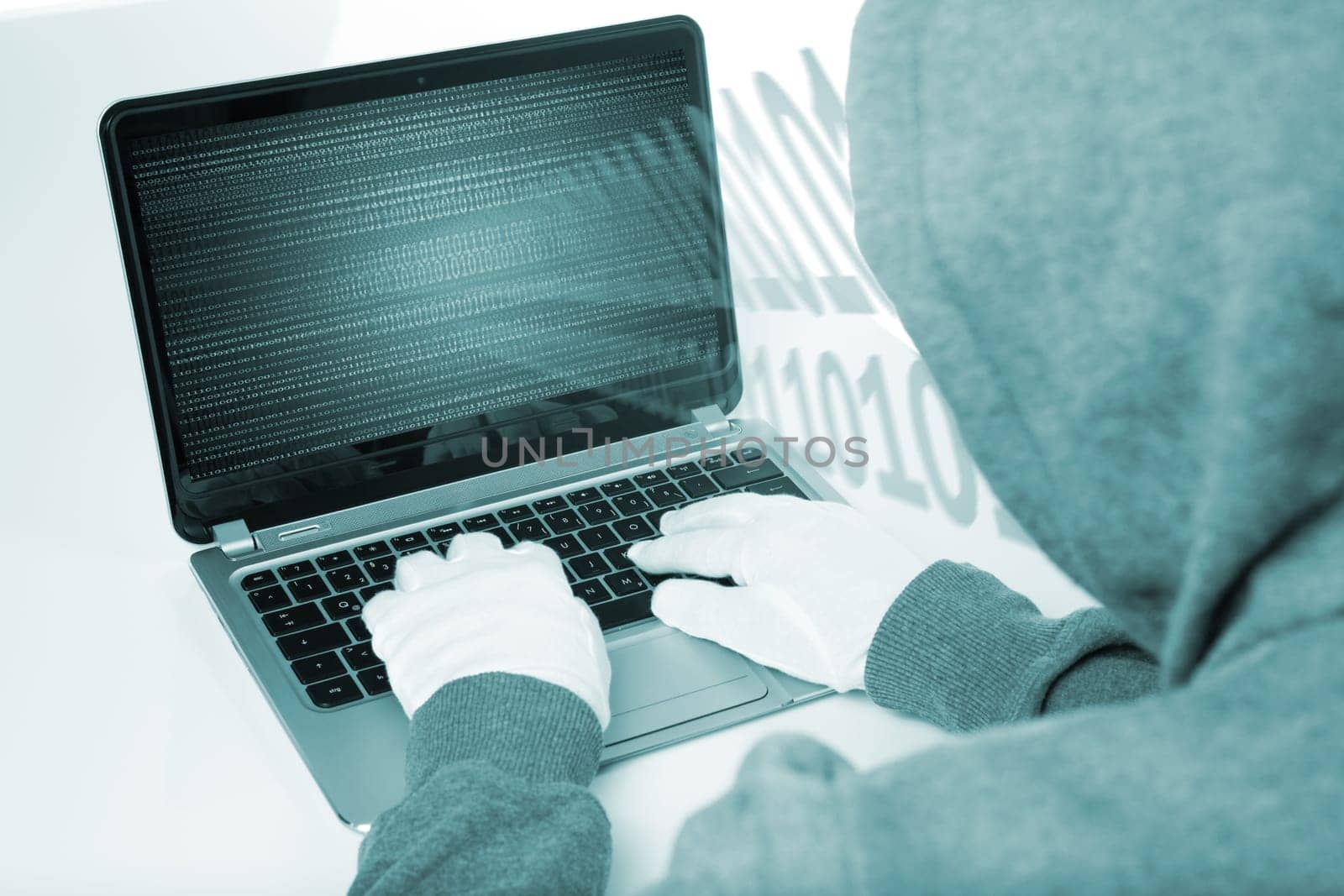 hacker on computer with white gloves