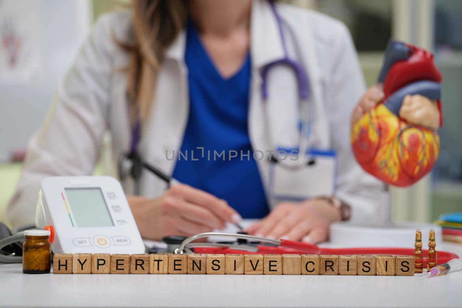 A healthcare provider effectively managing a hypertensive crisis using precise monitoring tools and techniques