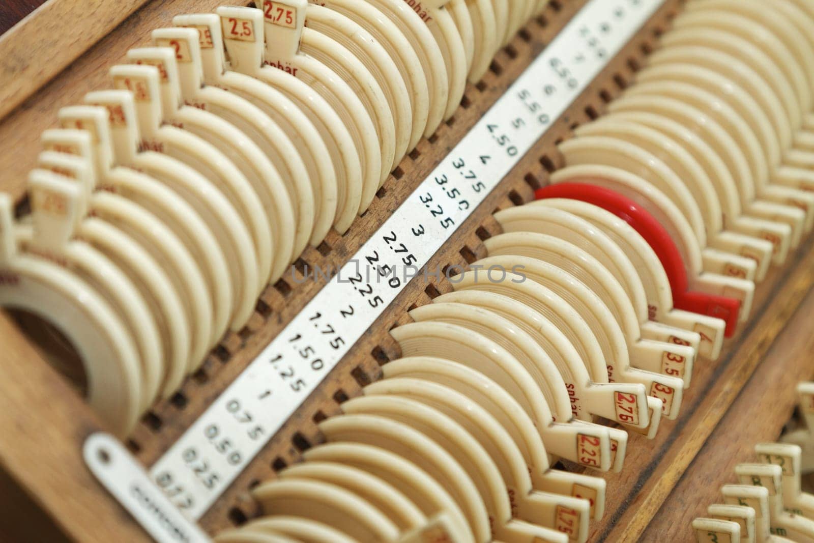 Optician with set of trial frames and trial lenses