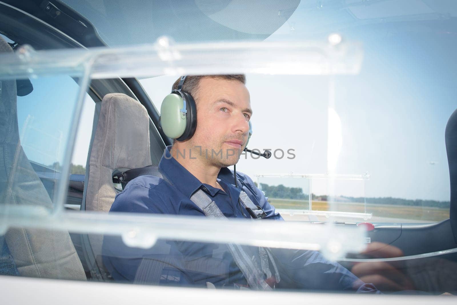 Side view of pilot in aircraft