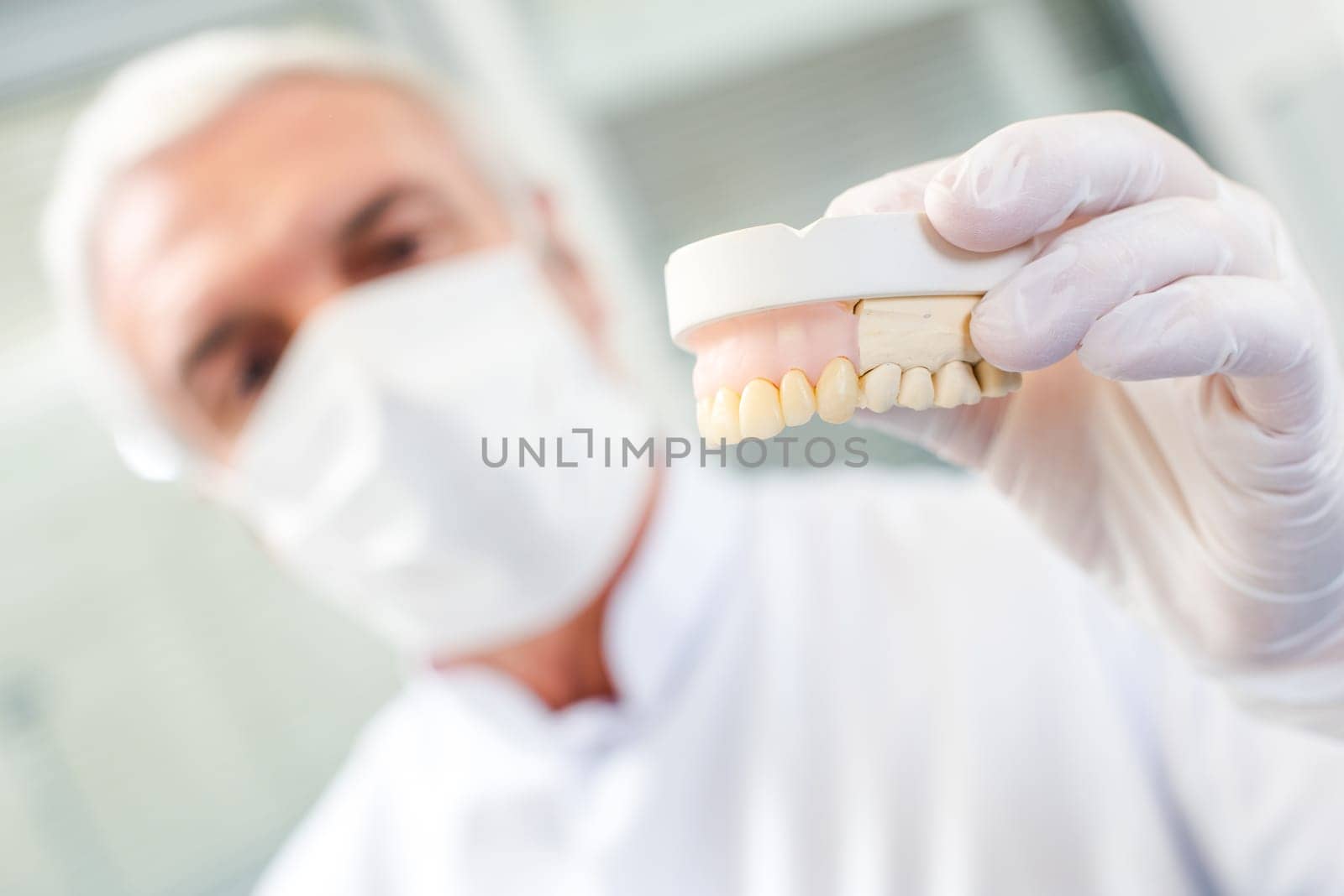 Dentist holding up a dental mould
