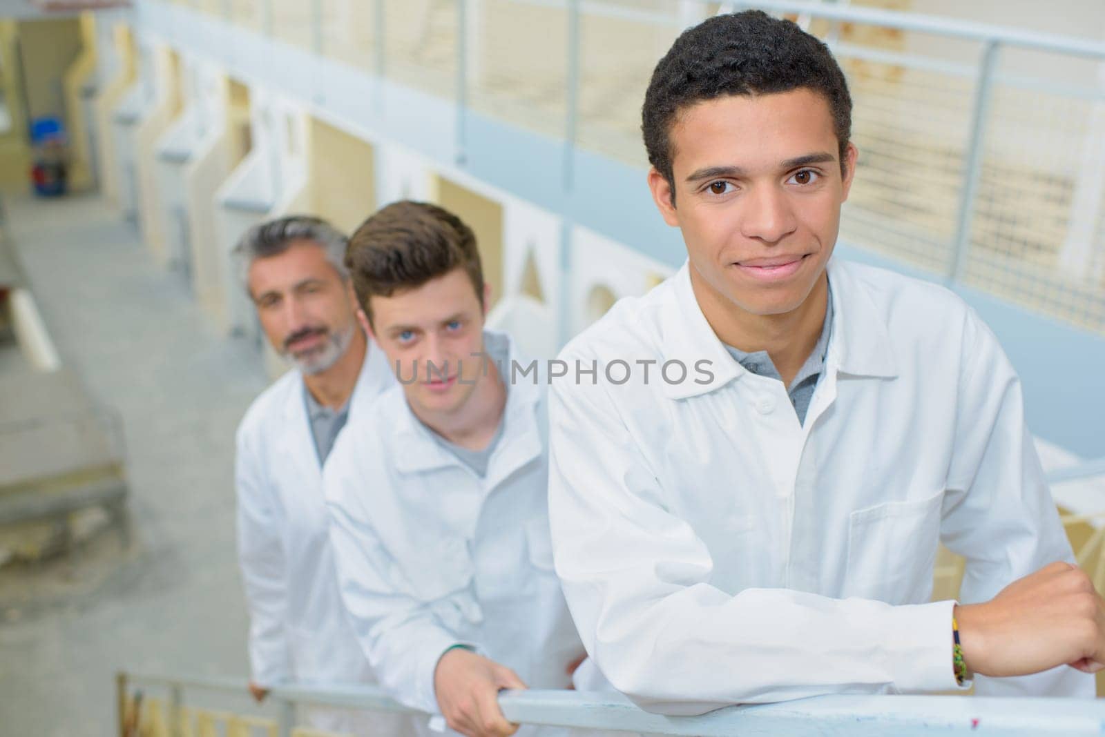 three men in the stairs