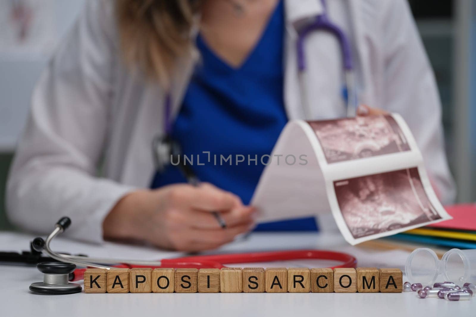 A dedicated healthcare professional is reviewing and analyzing Kaposi Sarcoma images in a clinical setting