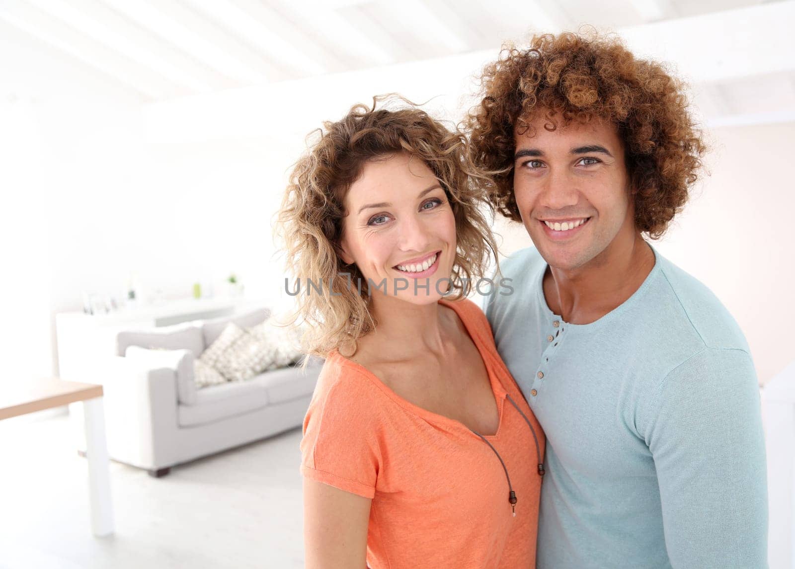 Cheerful couple standing in their new place