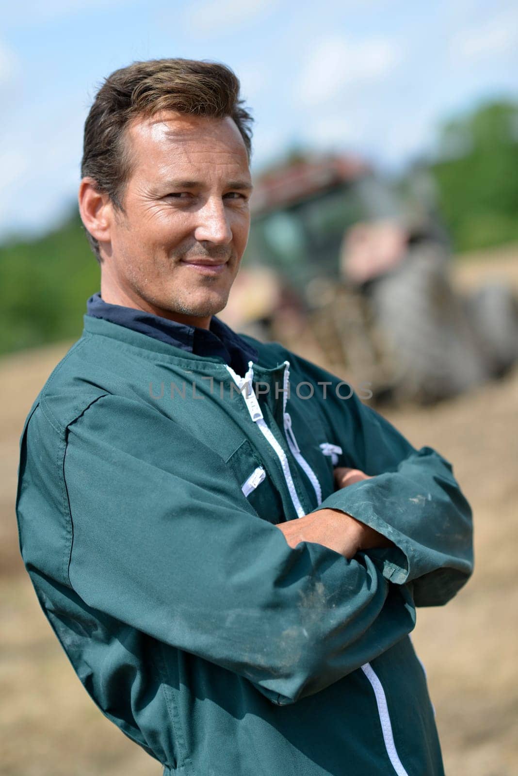 Portrait of smiling farmer in cultivated land