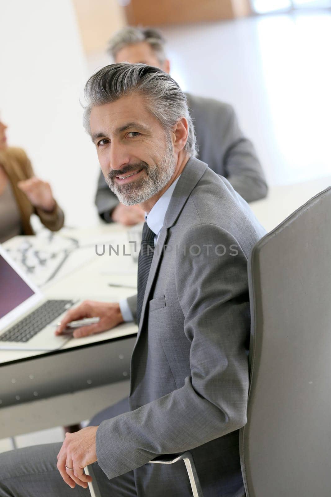 Portrait of architect meeting with clients in office
