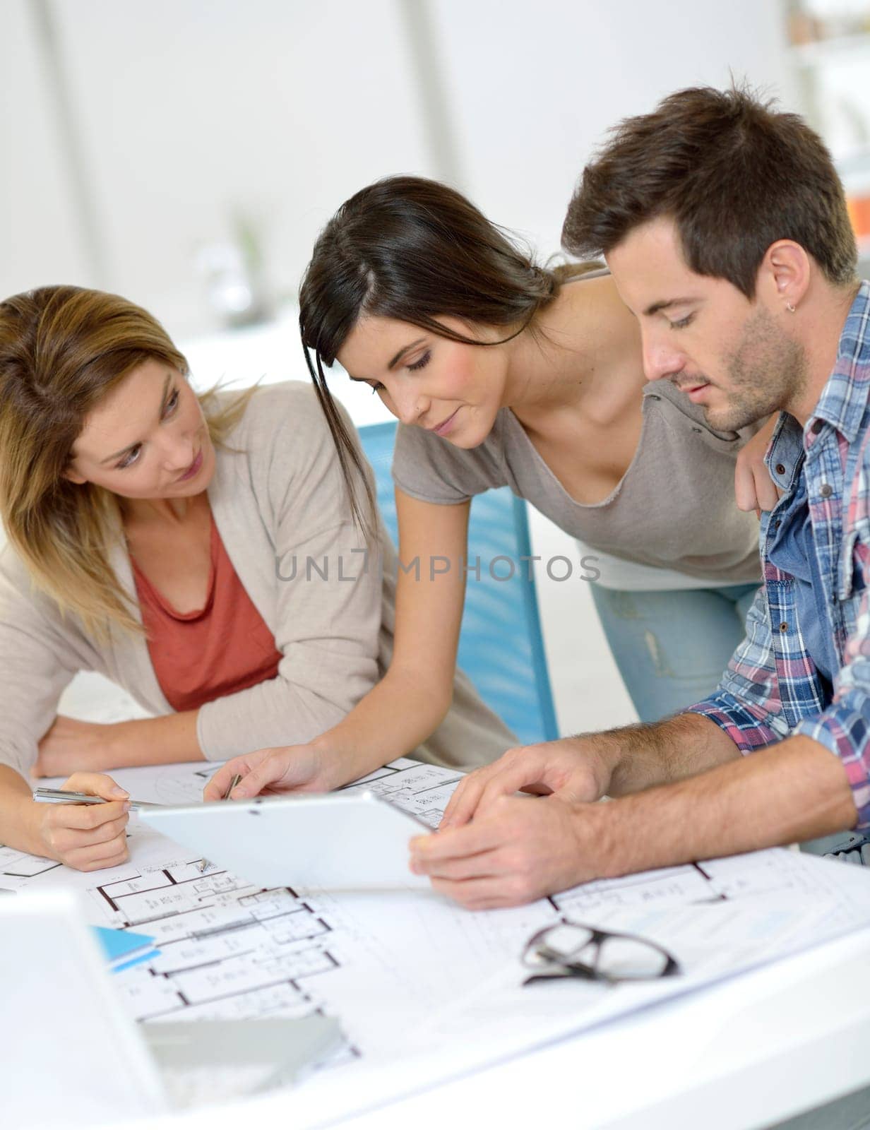 Workteam of architects meeting in office