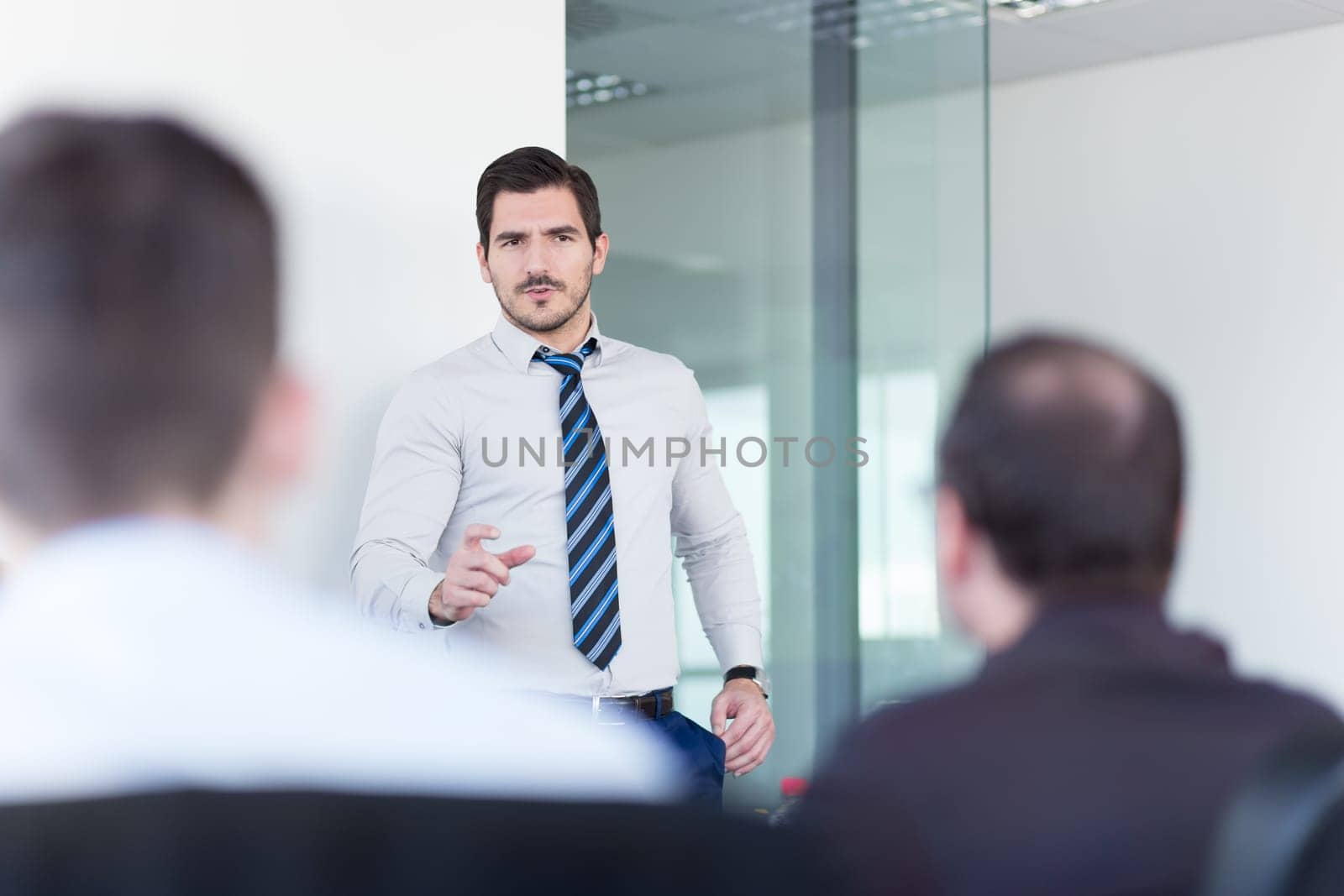 Team manager and business owner leading in-house business meeting. Business and entrepreneurship concept.