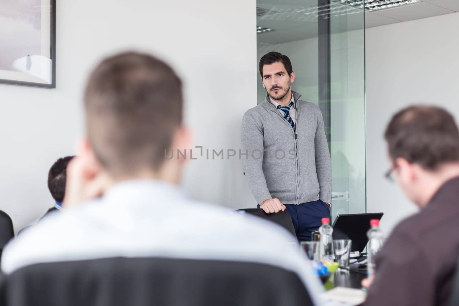 Team manager and business owner leading in-house business meeting. Business and entrepreneurship concept.
