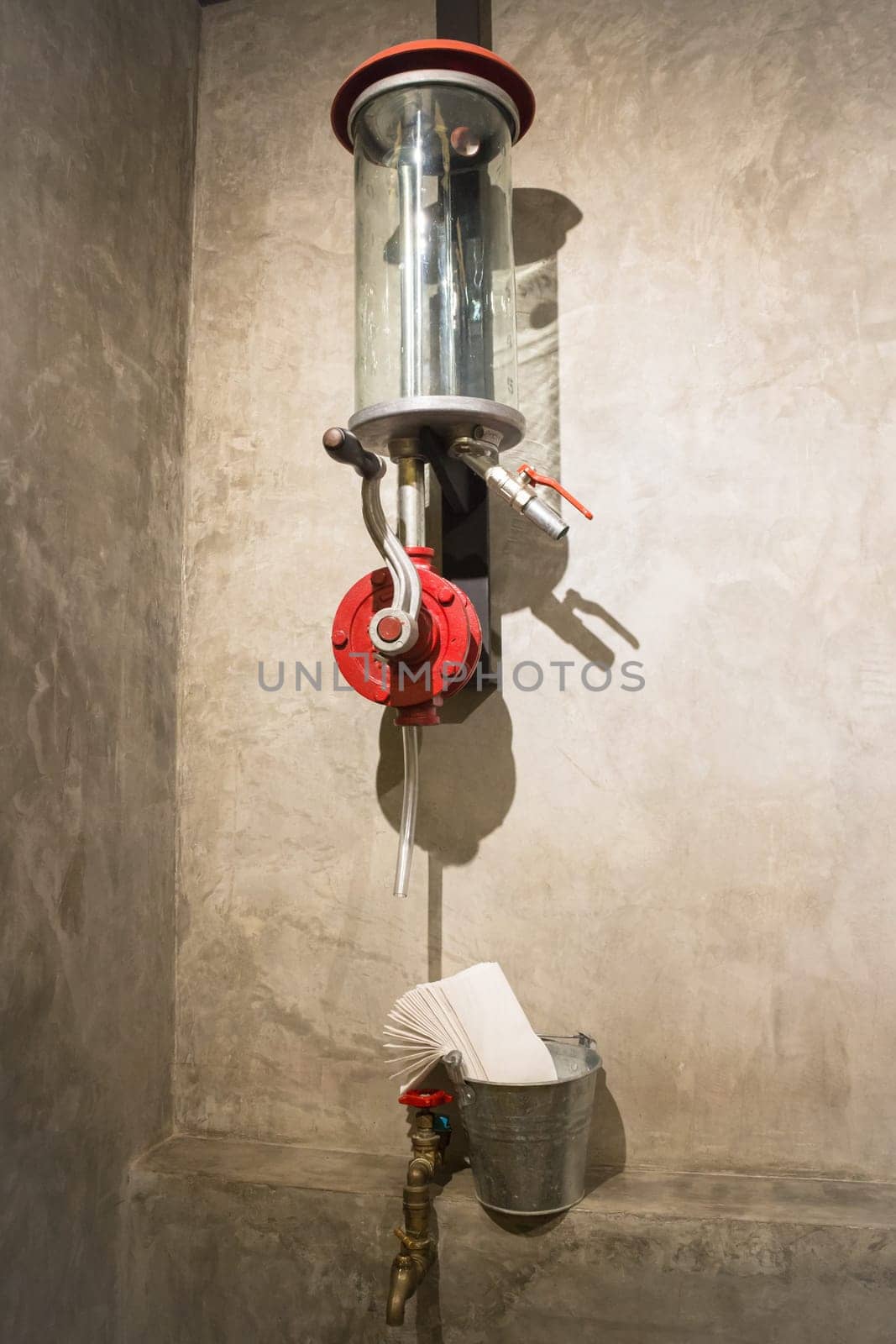 Vintage water tap decotated on grey wall, stock photo