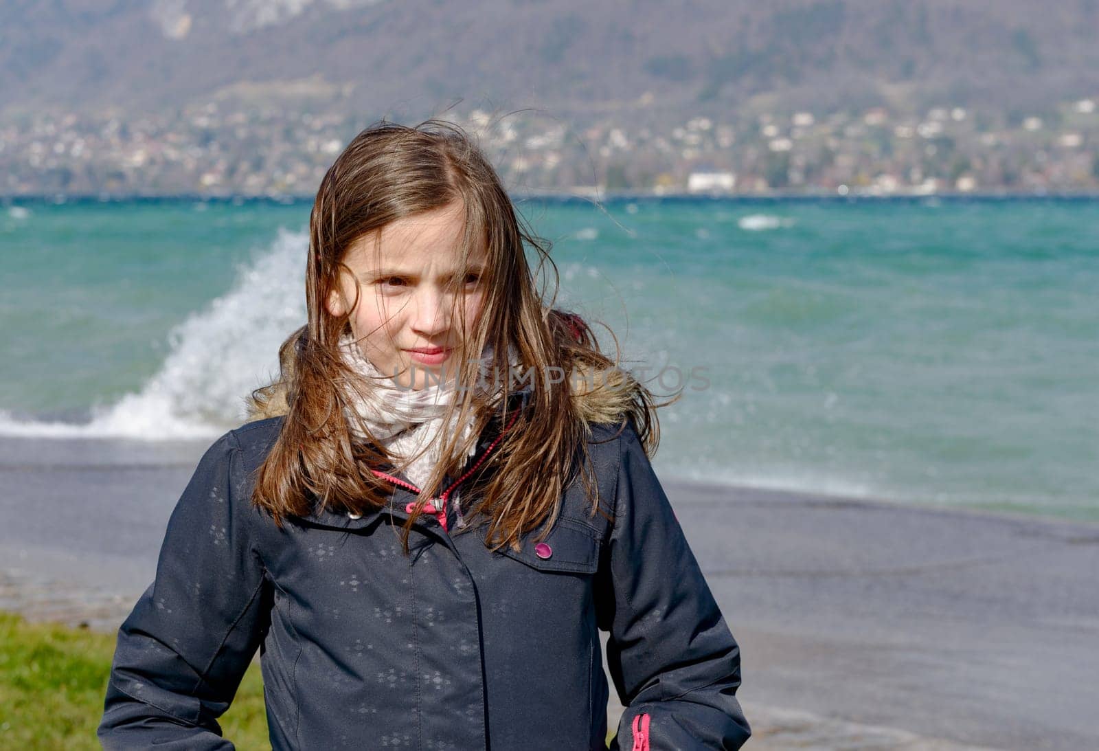a preteen girl with hair in the wind