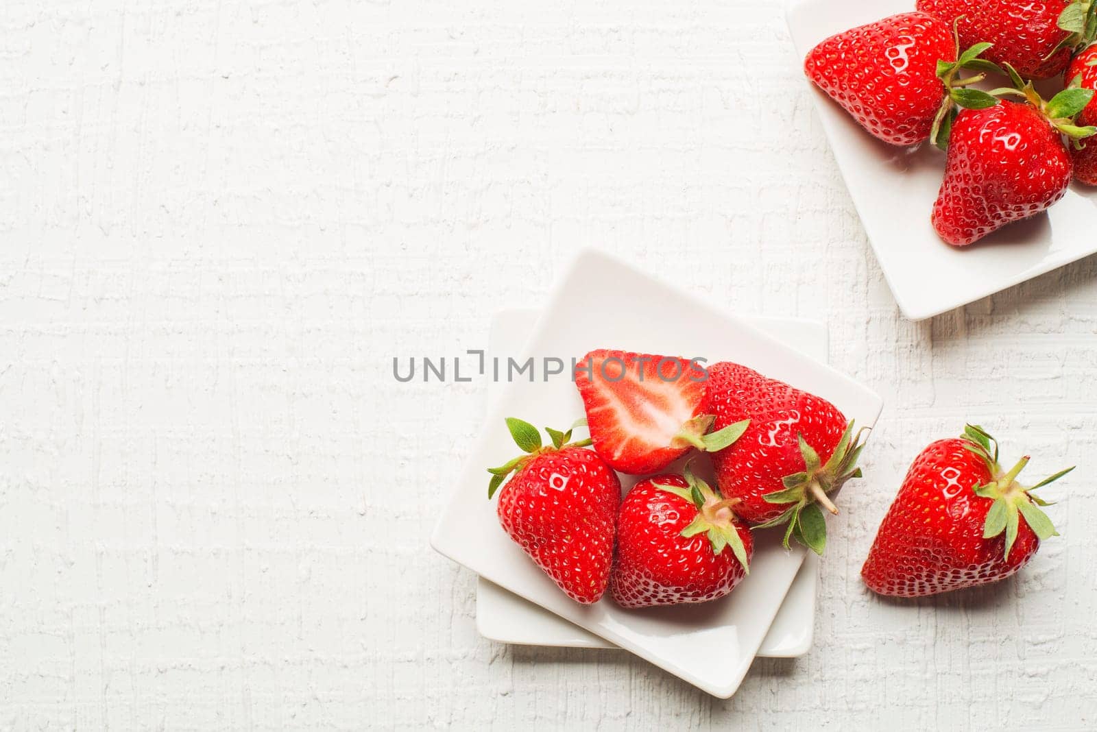 Fresh red Strawberries fruits on a white background.