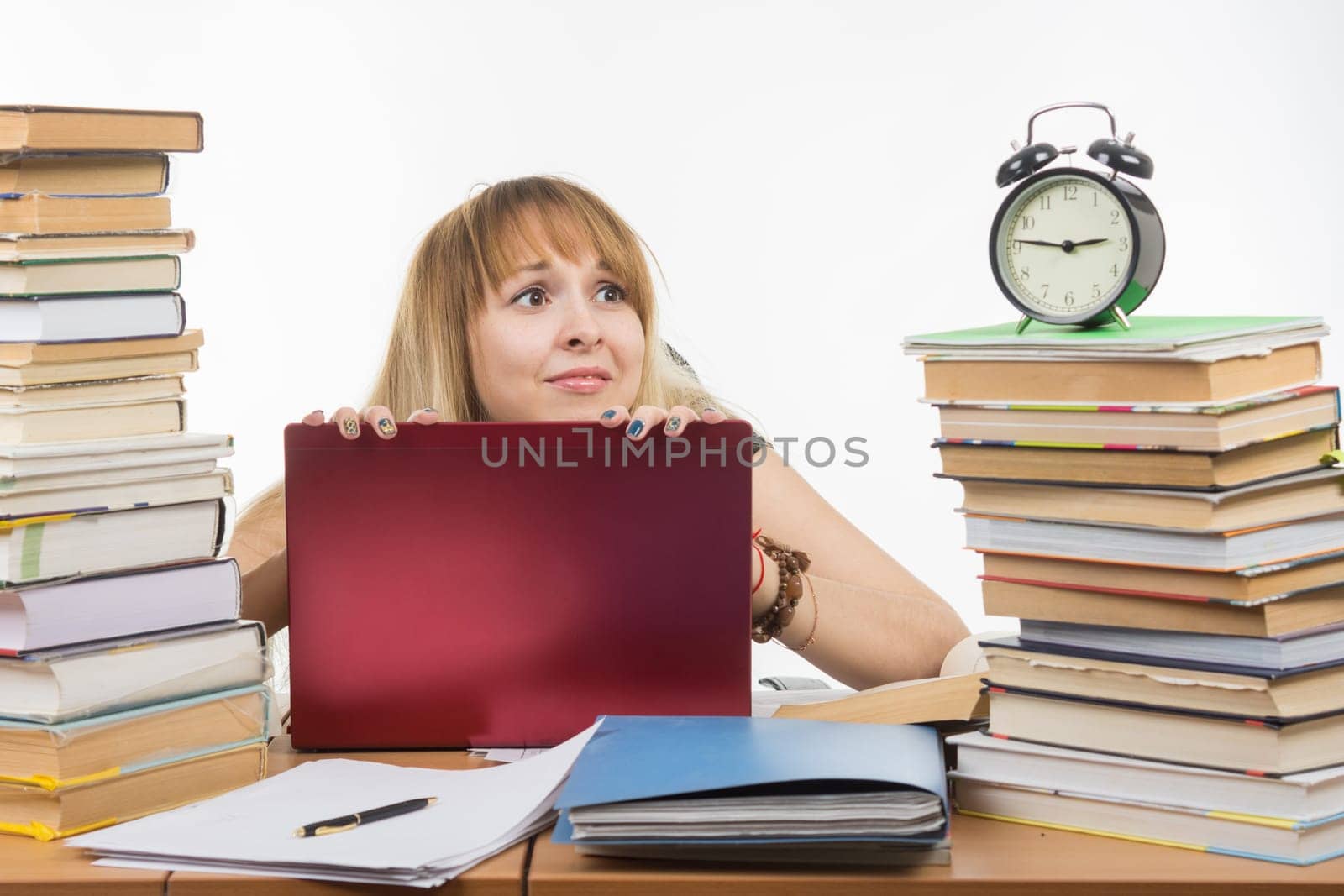 The student looks at his watch and realizes that the exam is already close