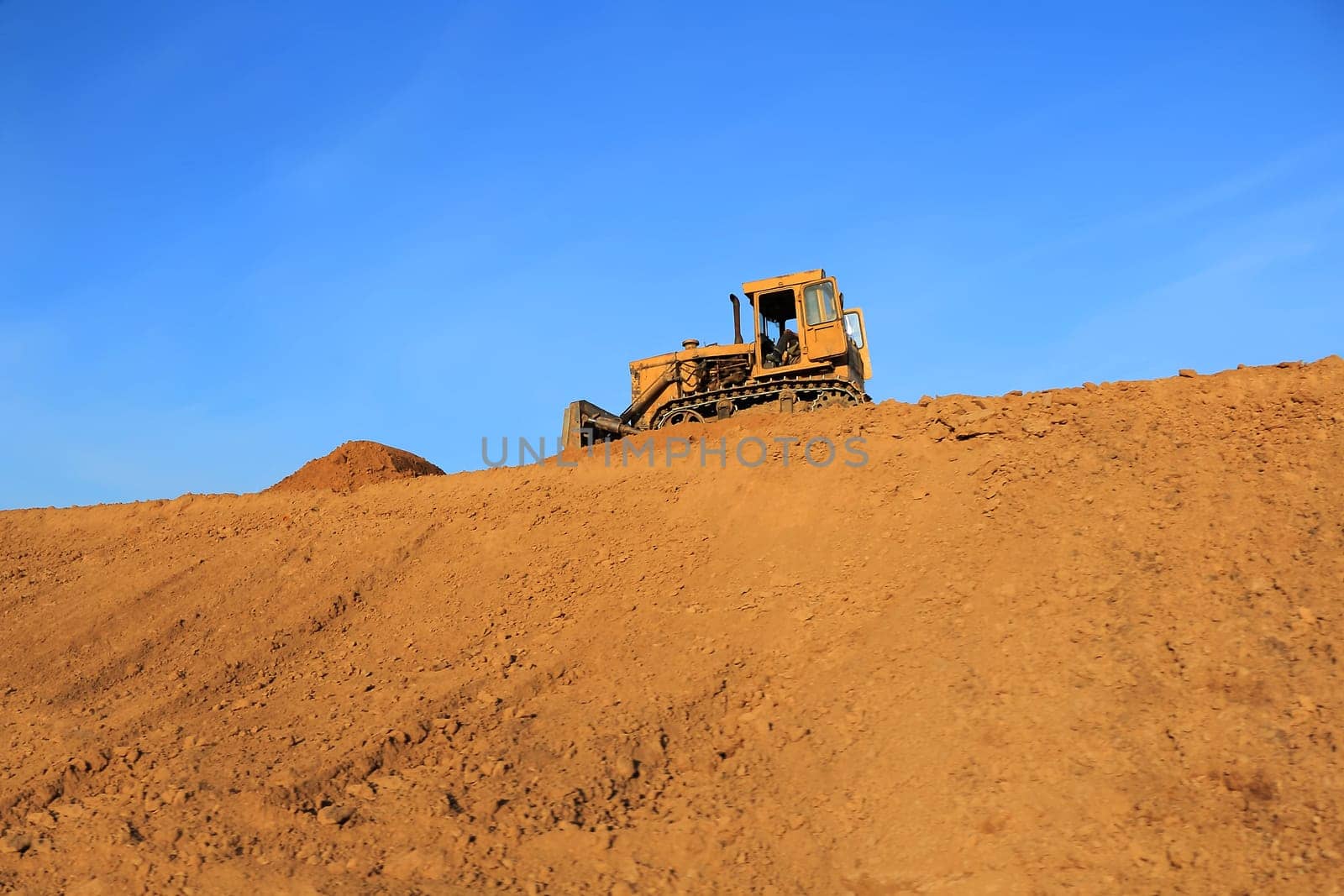 Image of rural landscape with agricultural machine
