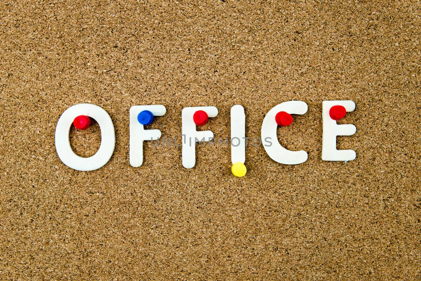 Word OFFICE made of wooden letters and thumbtacks on cork notice board, business concept