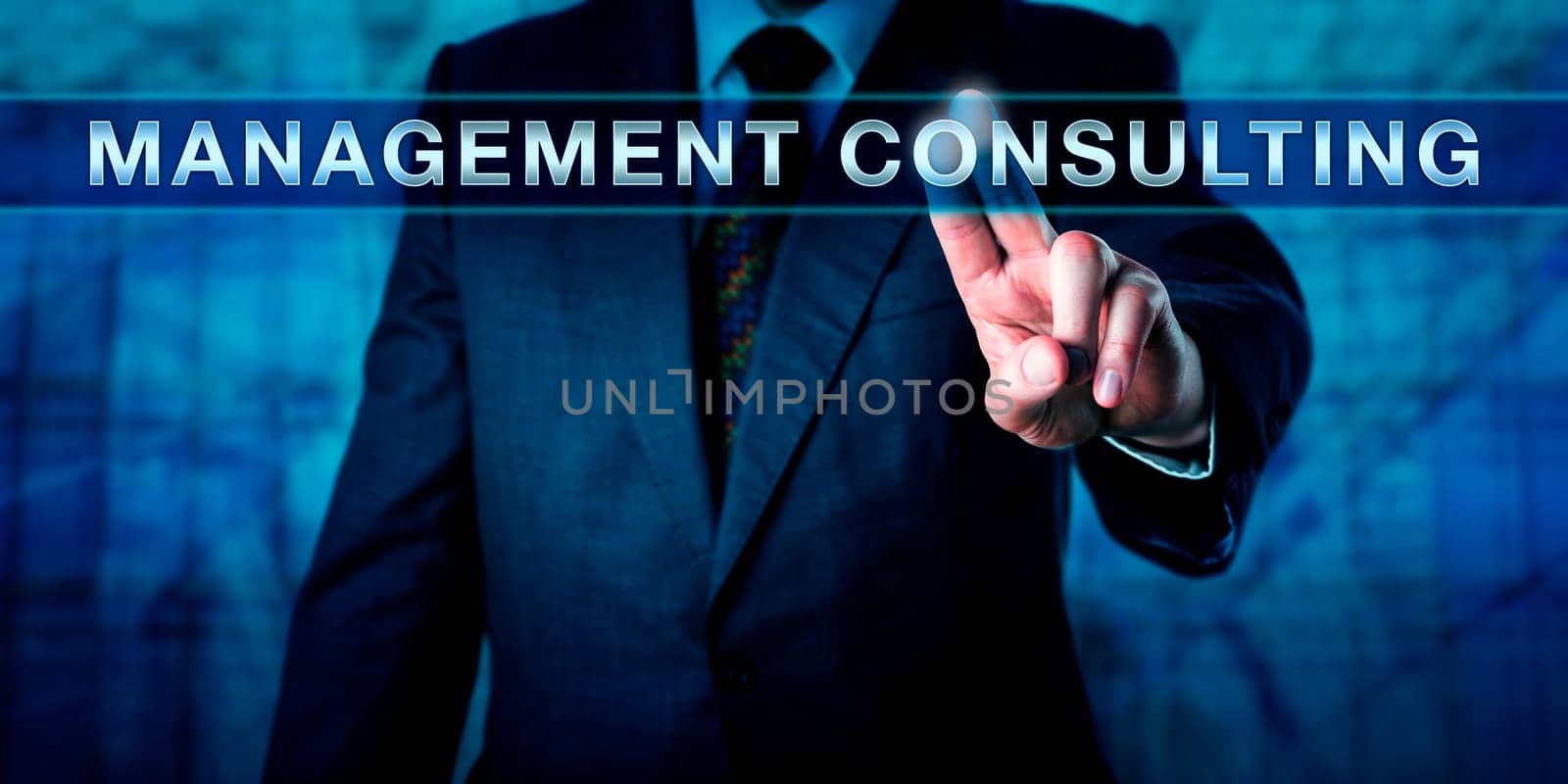 Businessman is touching MANAGEMENT CONSULTING on an interactive touch screen. Business metaphor and industry concept for the practice of professional assistance with organisational change.