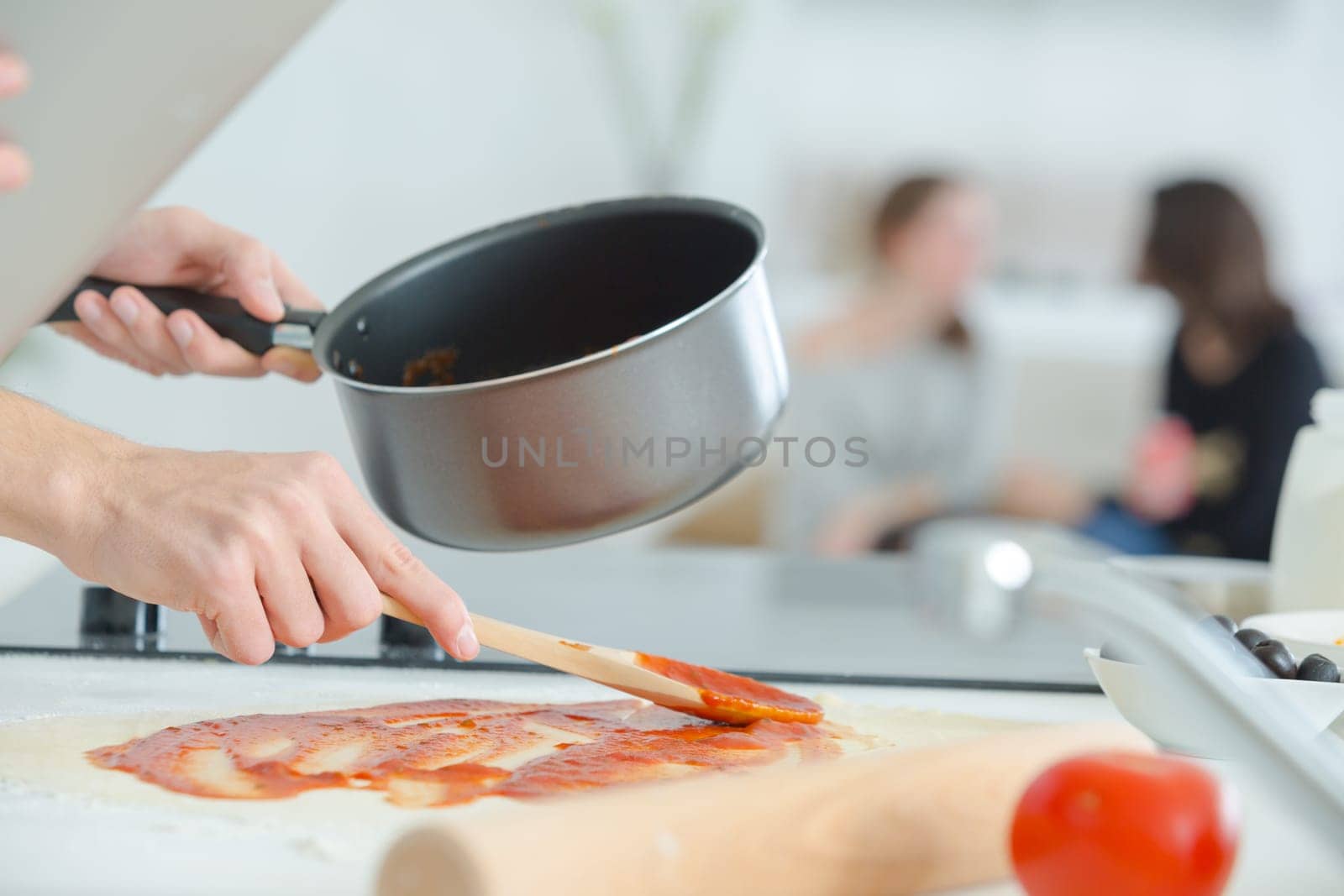 Man preparing a tomato sauce