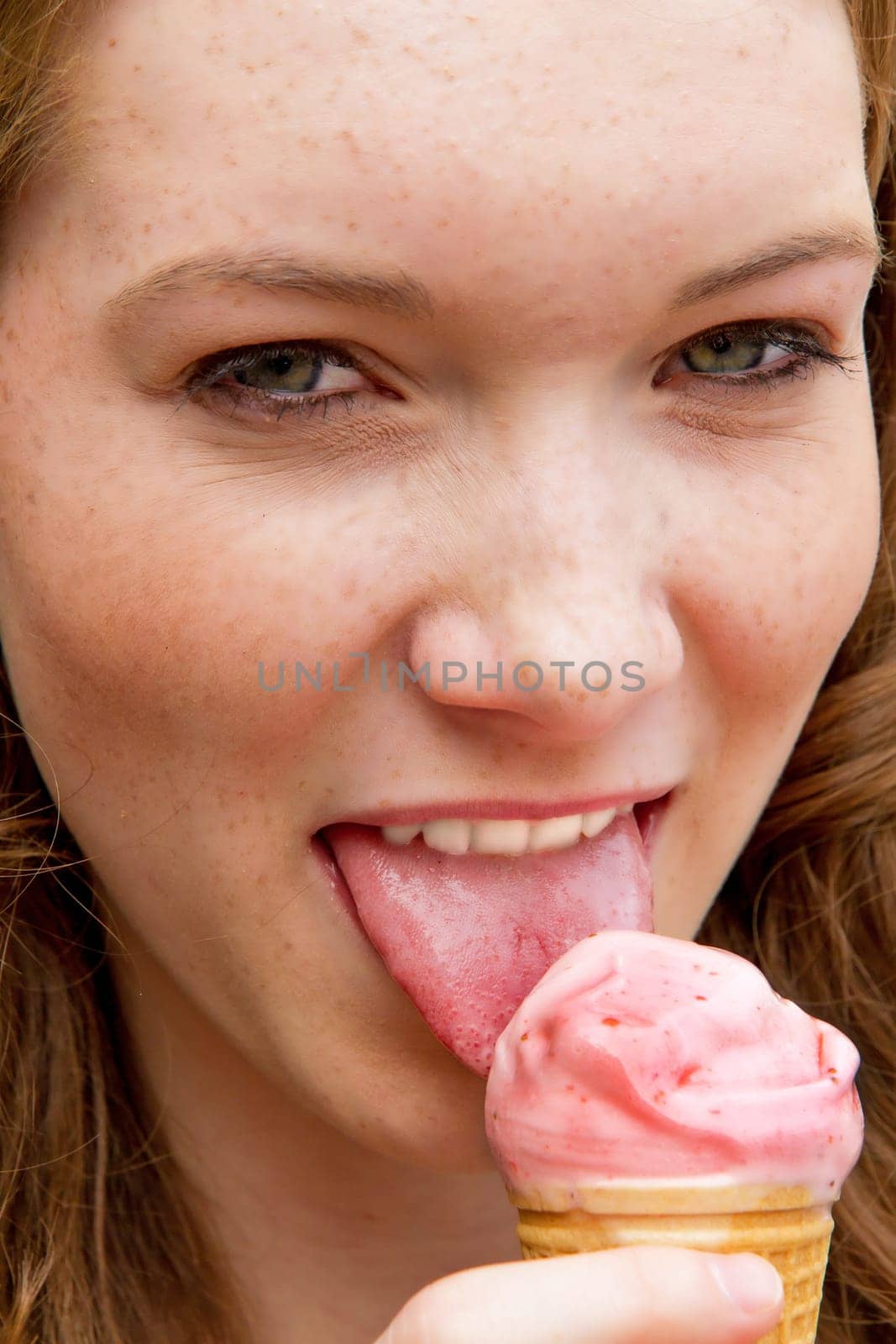 Young woman in summer with strawberry ice cream