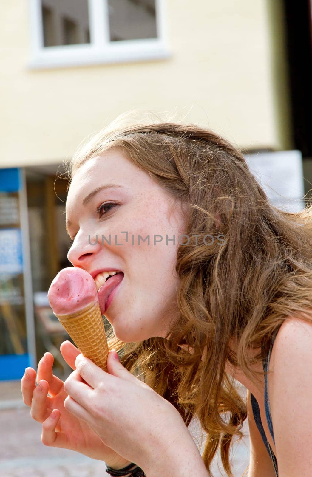 Young woman eating ice cream