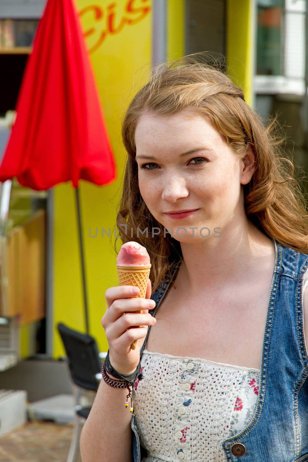 Young woman eating ice cream