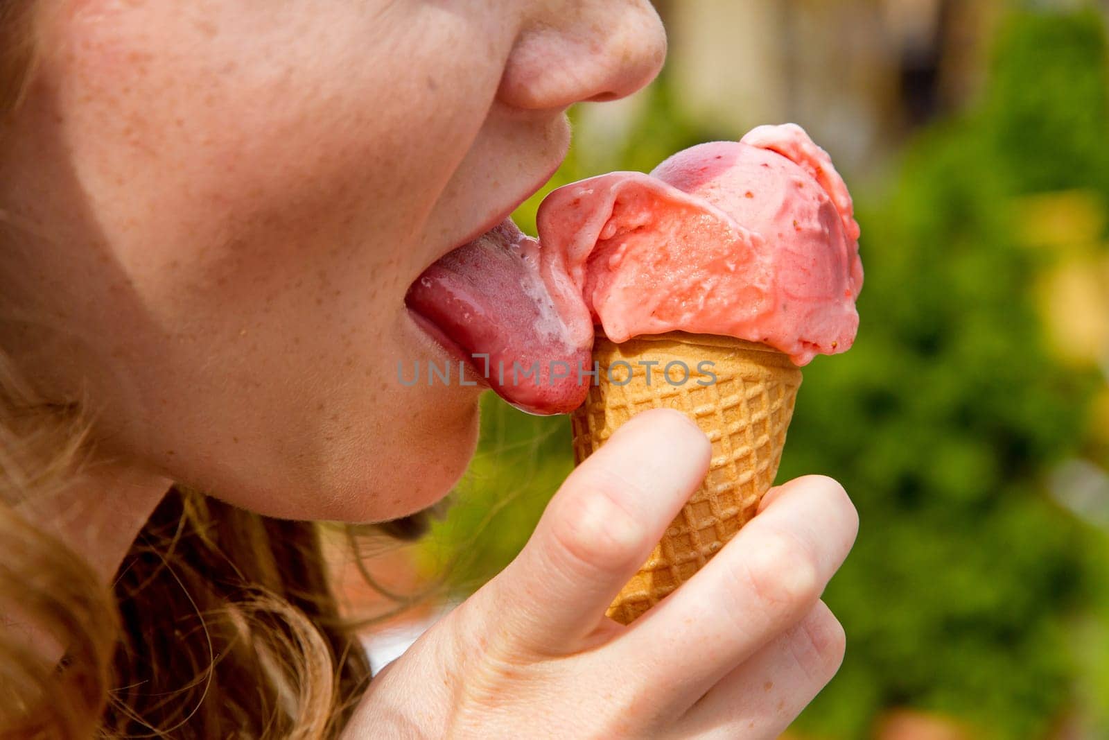 Young woman eating ice cream