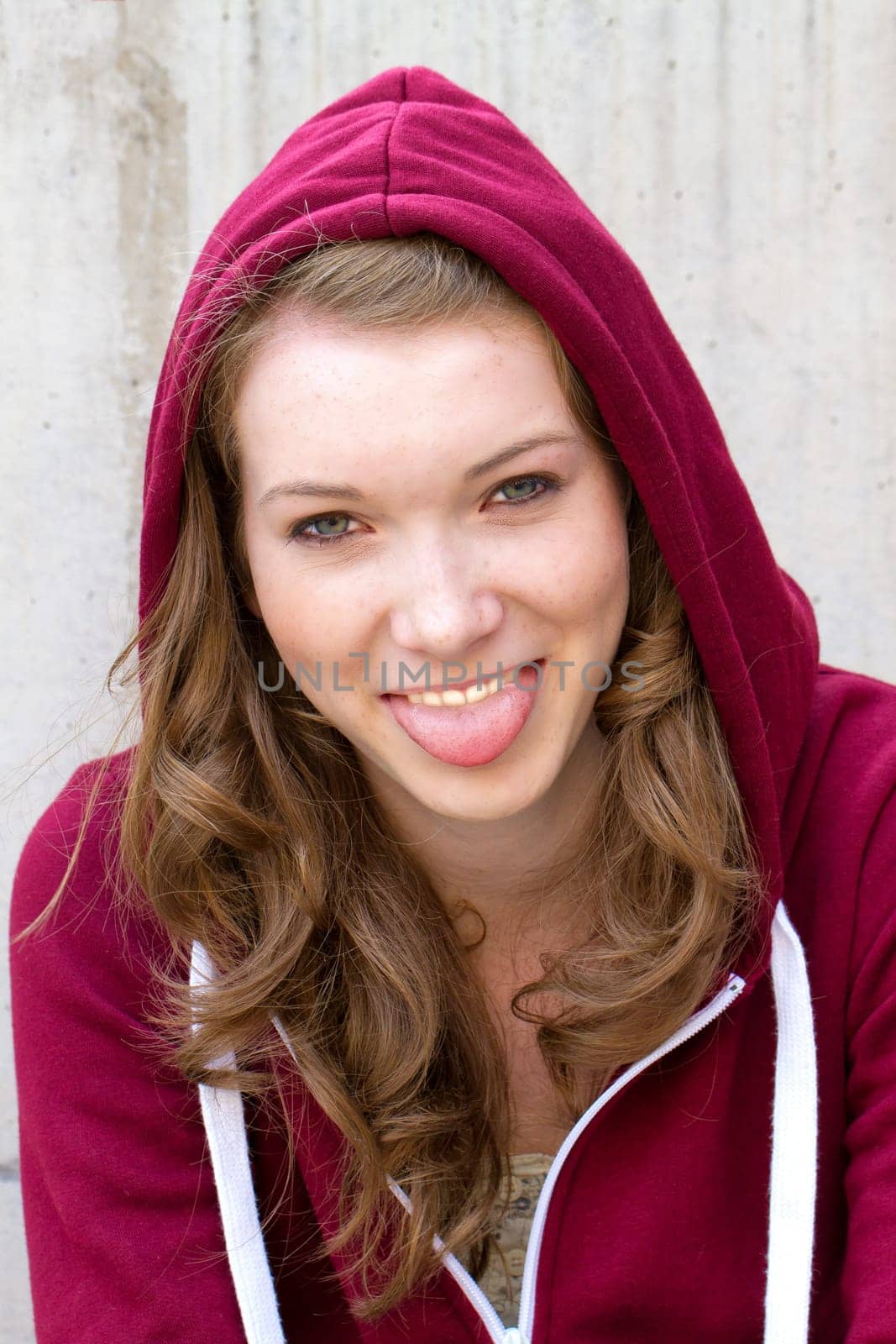 Teenager sticks out his tongue