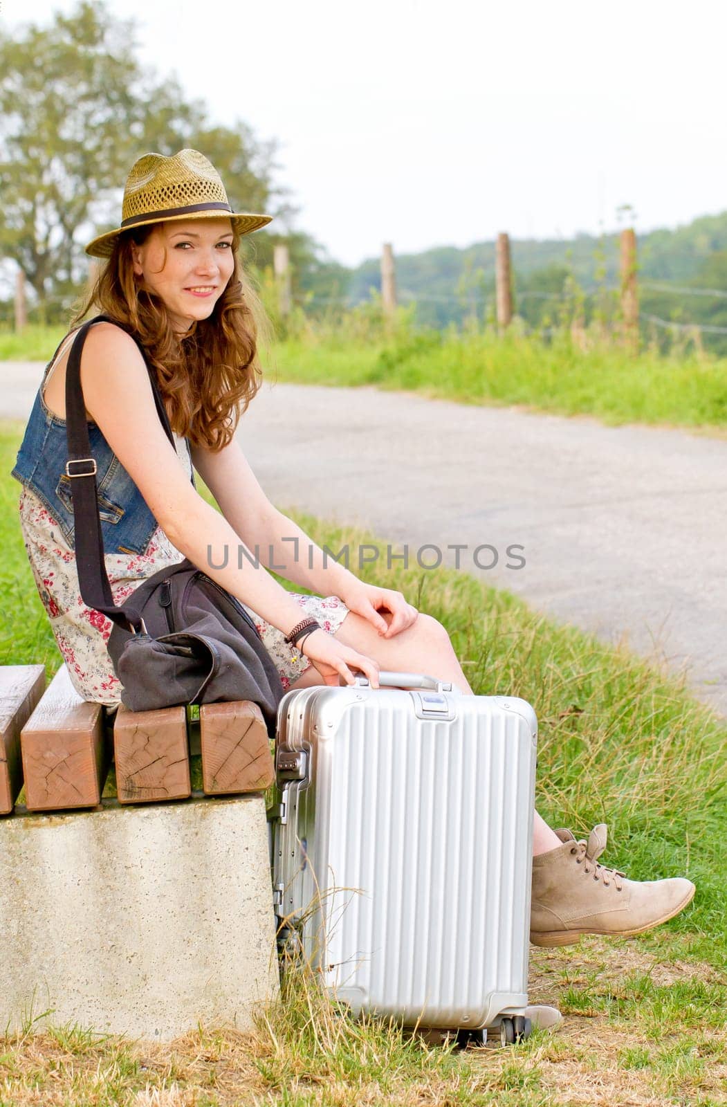 Girl with suitcase waiting for departure