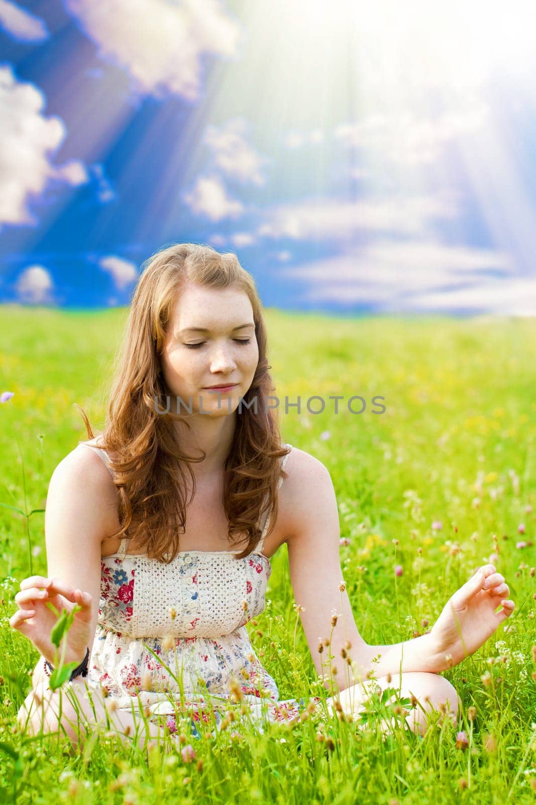 Young woman meditating in nature